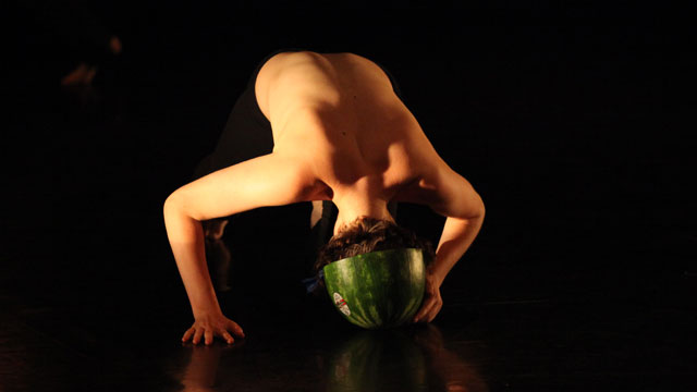 Performer dons watermelon helmet