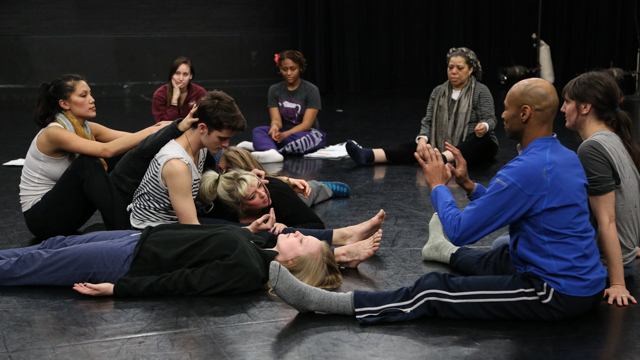 Laurie Carlos leads MANCC class students and visiting artists in a group exercise