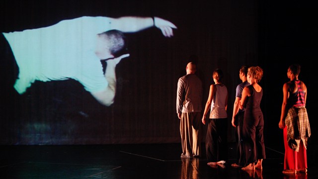 <i>Healing Wars</i> informal showing performers view projected image of collaborator Josh Bleill