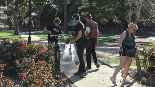 Johnson collaborators pick up trash during the Landis Green clean-up
