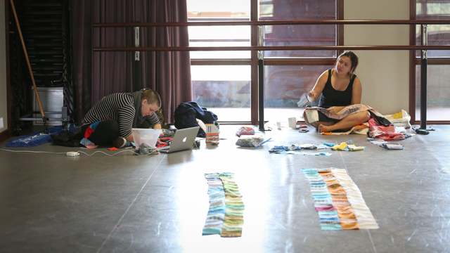Julia Bither and Maggie Thompson stitching quilts for <i> Then a Cunning Voice...</i>