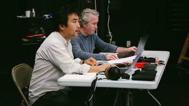 Nagai and lighting designer  Thomas Dunn watch rehearsal in the Black Box
