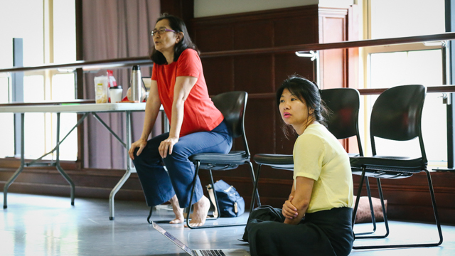 Donna Uchizono with Sophia Wang observing dancers during rehearsal</i>