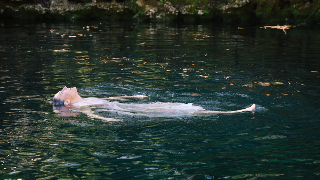 Doell floats in Madison Blue Springs during video shoot