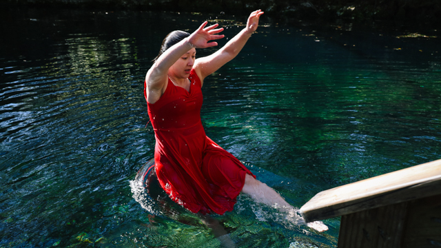 See jumps into the water at Madison Blue Springs during video shoot