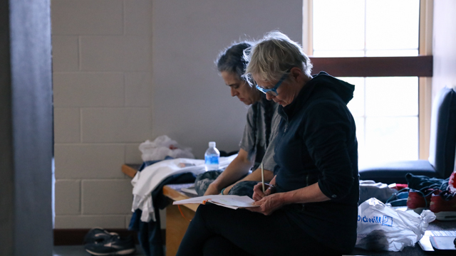Van Wieren and Van Loon take notes while working in studio