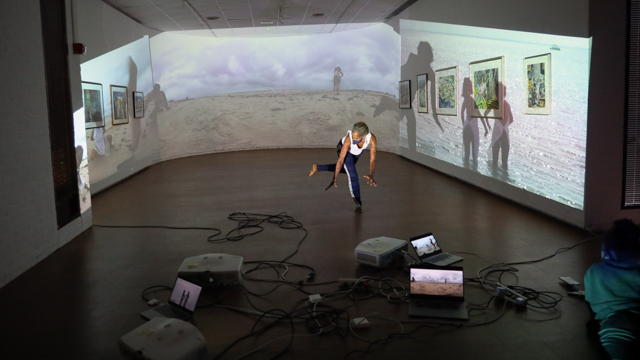 love rehearses with projections at Florida State University's Museum of Fine Arts