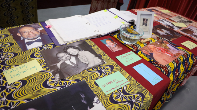 Photos and other items on a table in the studio in remembrance of Dr. William R. Jones