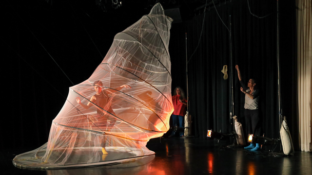 Leah Nelson dances while Brito and Picasso experiment with the movement of Brito's kinetic set design