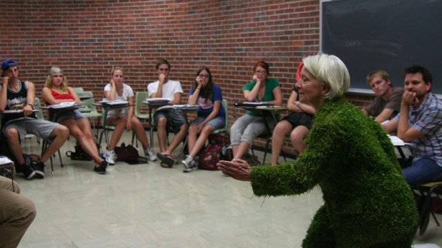 Carlson performs <i>Grass</i> for Theatre Professor George McConnell's Performing Arts class.
