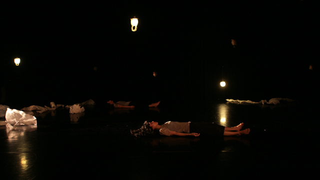 Emily Johnson and Aretha Aoki perform amidst the fish skin lanterns.